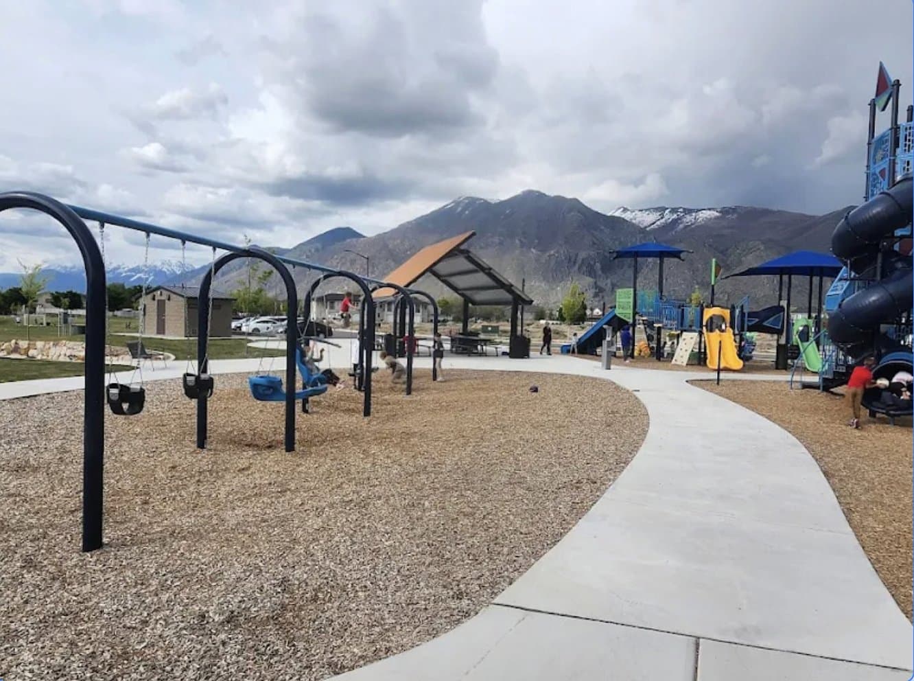 The Huntington Ranch community playground, with the Wasatch mountains beyond.